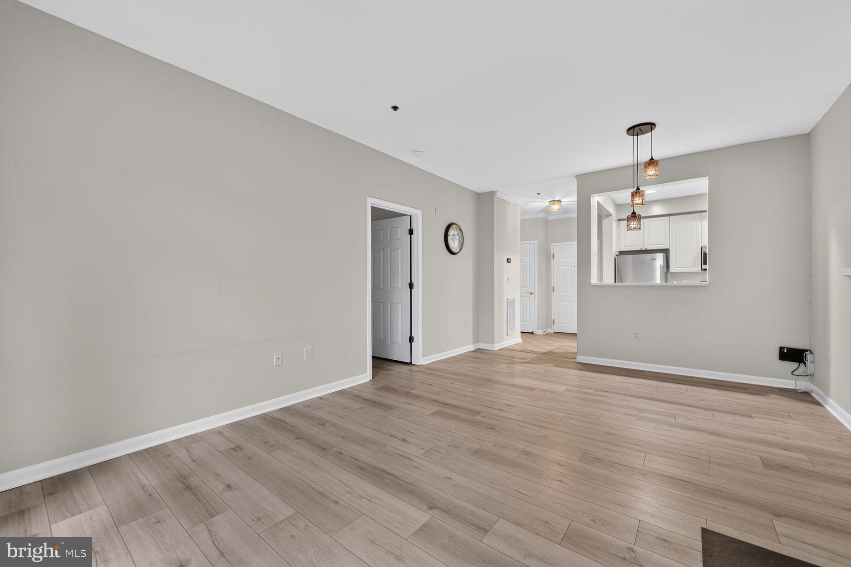 11775 Stratford House Place, Unit 112 Reston, VA 20190 - Photo 19 of 53 Living Room & Dining Area