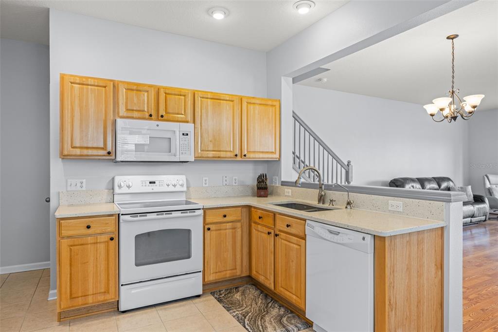 4921 Pond Ridge Drive Riverview, FL 33578 - Photo 11 of 40 a kitchen with a sink stove and cabinets