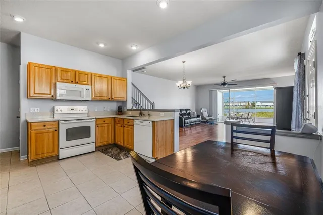 a kitchen with a stove a sink and counter top space
