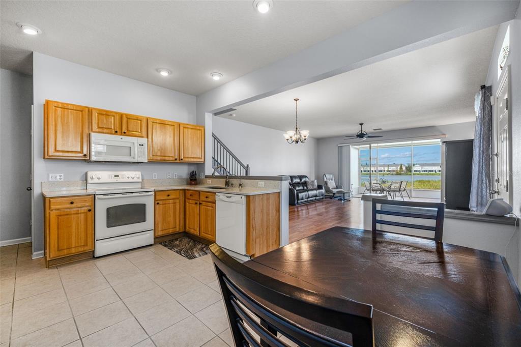 4921 Pond Ridge Drive Riverview, FL 33578 - Photo 13 of 40 a kitchen with a stove a sink and counter top space