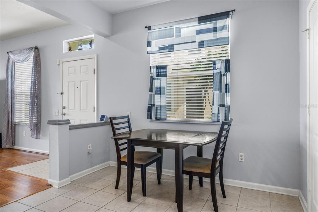 4921 Pond Ridge Drive Riverview, FL 33578 - Photo 14 of 40 a view of a dining room with furniture and window