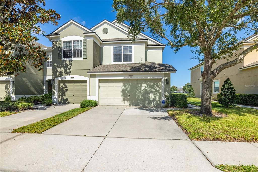 4921 Pond Ridge Drive Riverview, FL 33578 - Photo 2 of 40 a front view of a house with a yard and garage