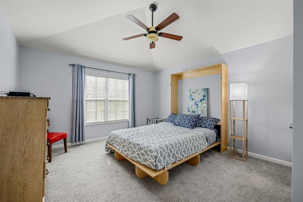 4921 Pond Ridge Drive Riverview, FL 33578 - Photo 21 of 40 a bedroom with a bed and window