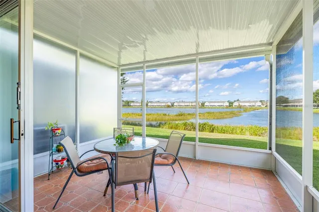 a view of a room with a table and chairs