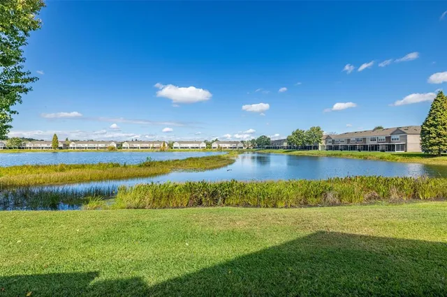 a view of a city with swimming pool and outdoor seating