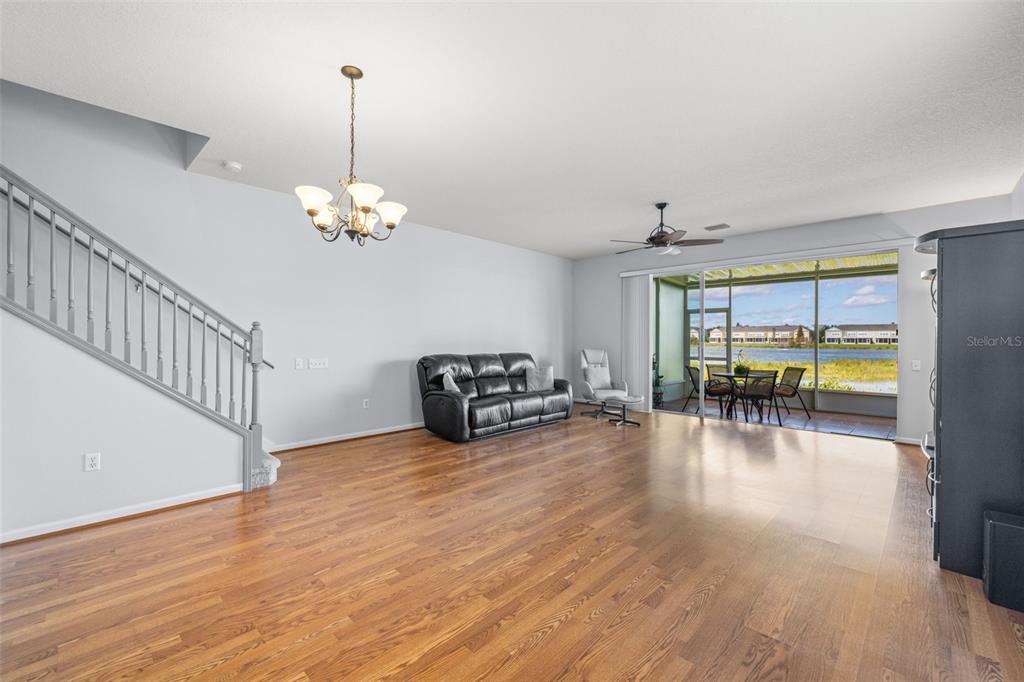 4921 Pond Ridge Drive Riverview, FL 33578 - Photo 6 of 40 a view of a livingroom with wooden floor and a floor to ceiling window