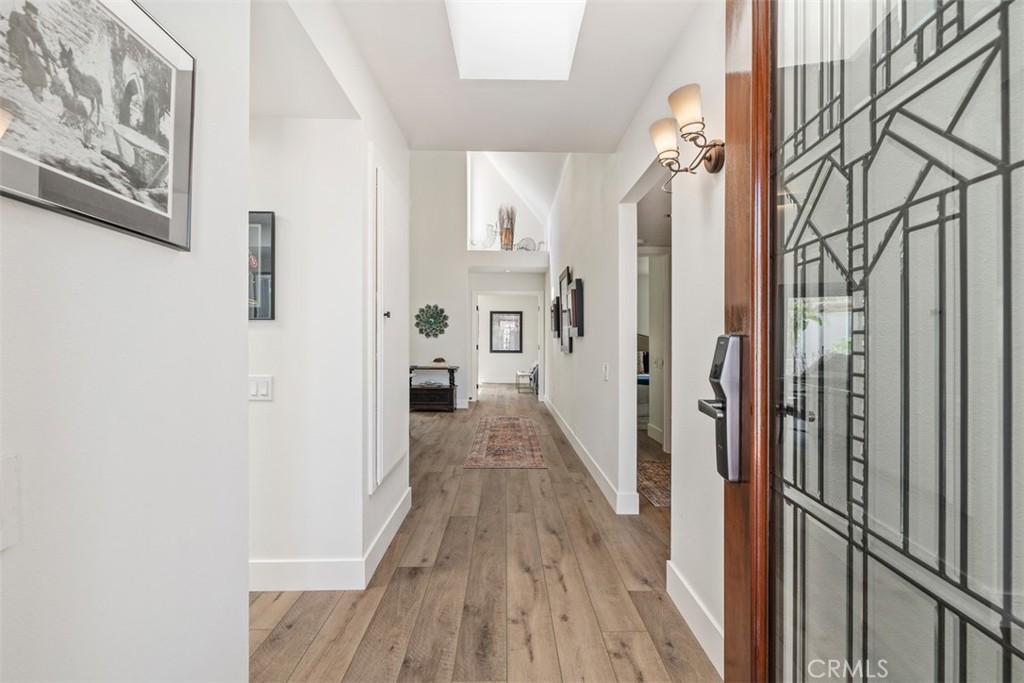 23862 Marmara Bay Dana Point, CA 92629 - Photo 3 of 21 a view of a hallway with wooden floor and staircase