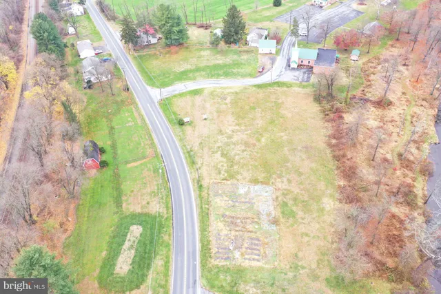 a view of a swimming pool with a yard