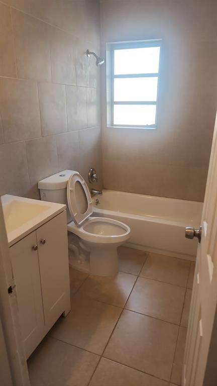 5250 Southwest 90th Way, Unit 3 Cooper City, FL 33328 - Photo 2 of 8 a bathroom with a toilet sink and window
