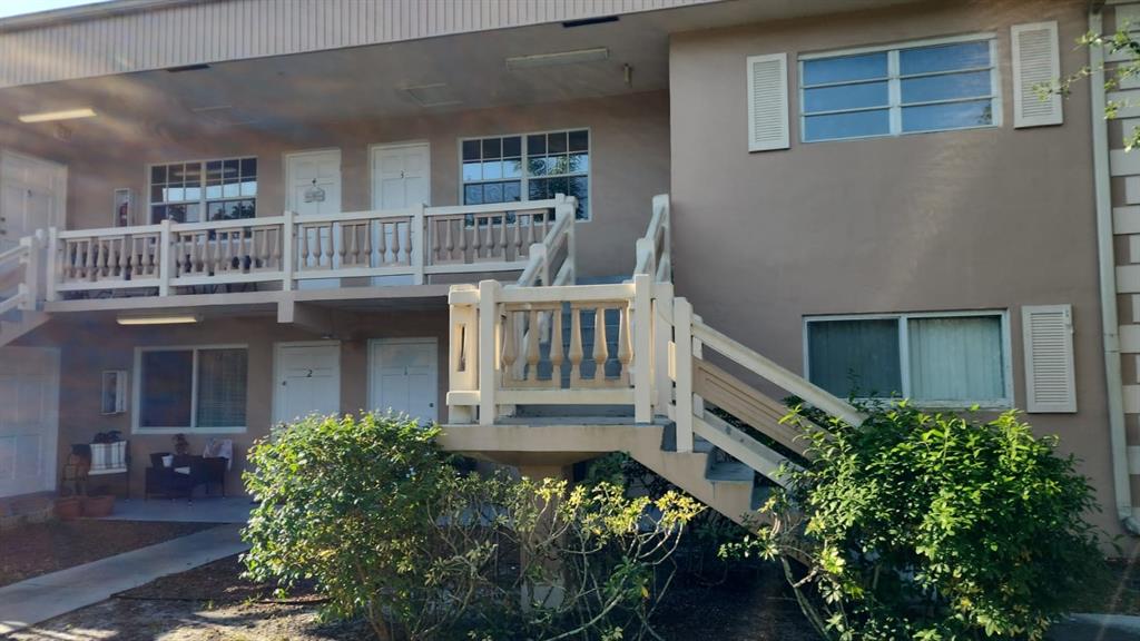 5250 Southwest 90th Way, Unit 3 Cooper City, FL 33328 - Photo 8 of 8 front view of house with a small yard