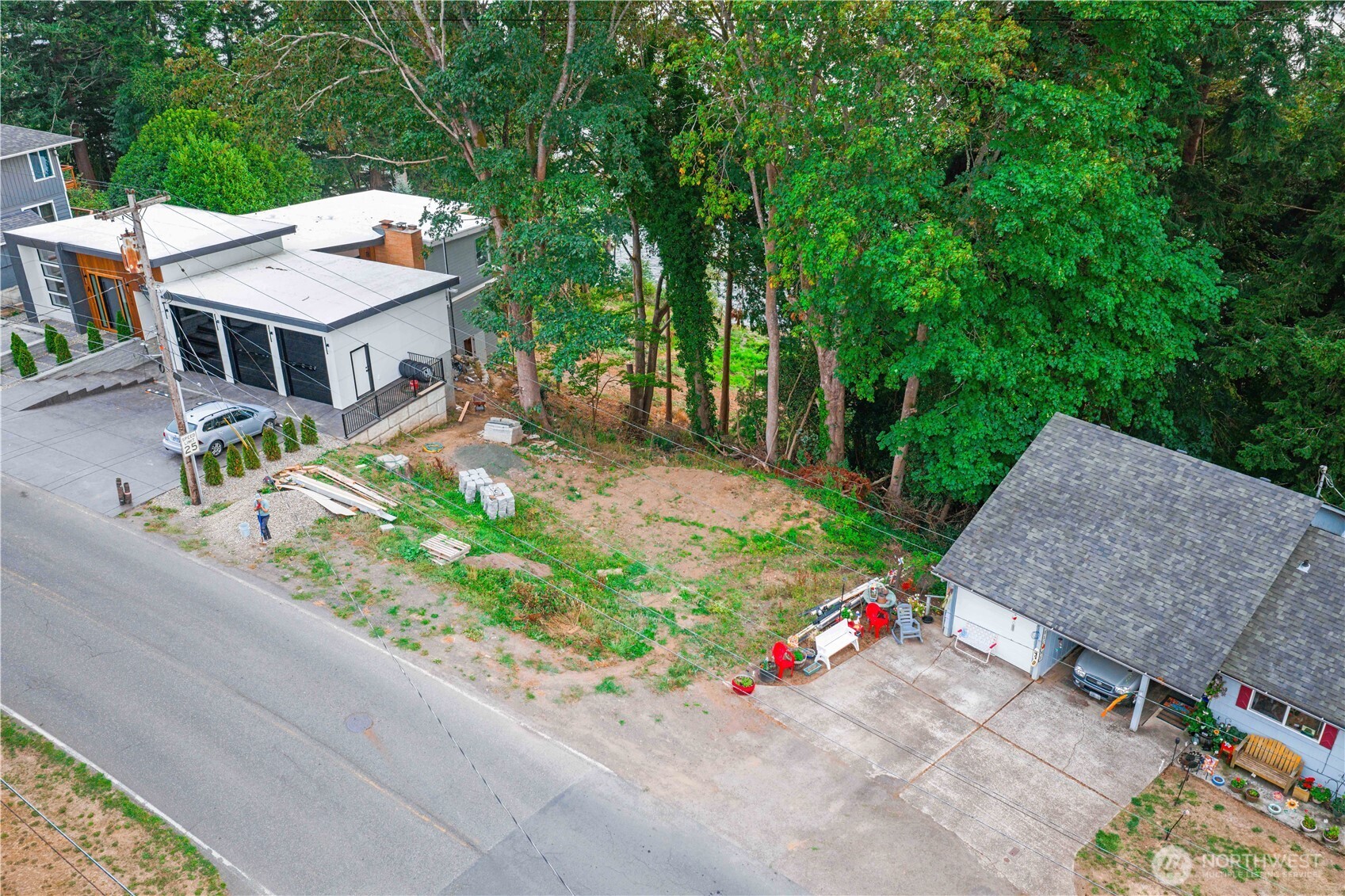 an aerial view of a house with a yard and potted plants
