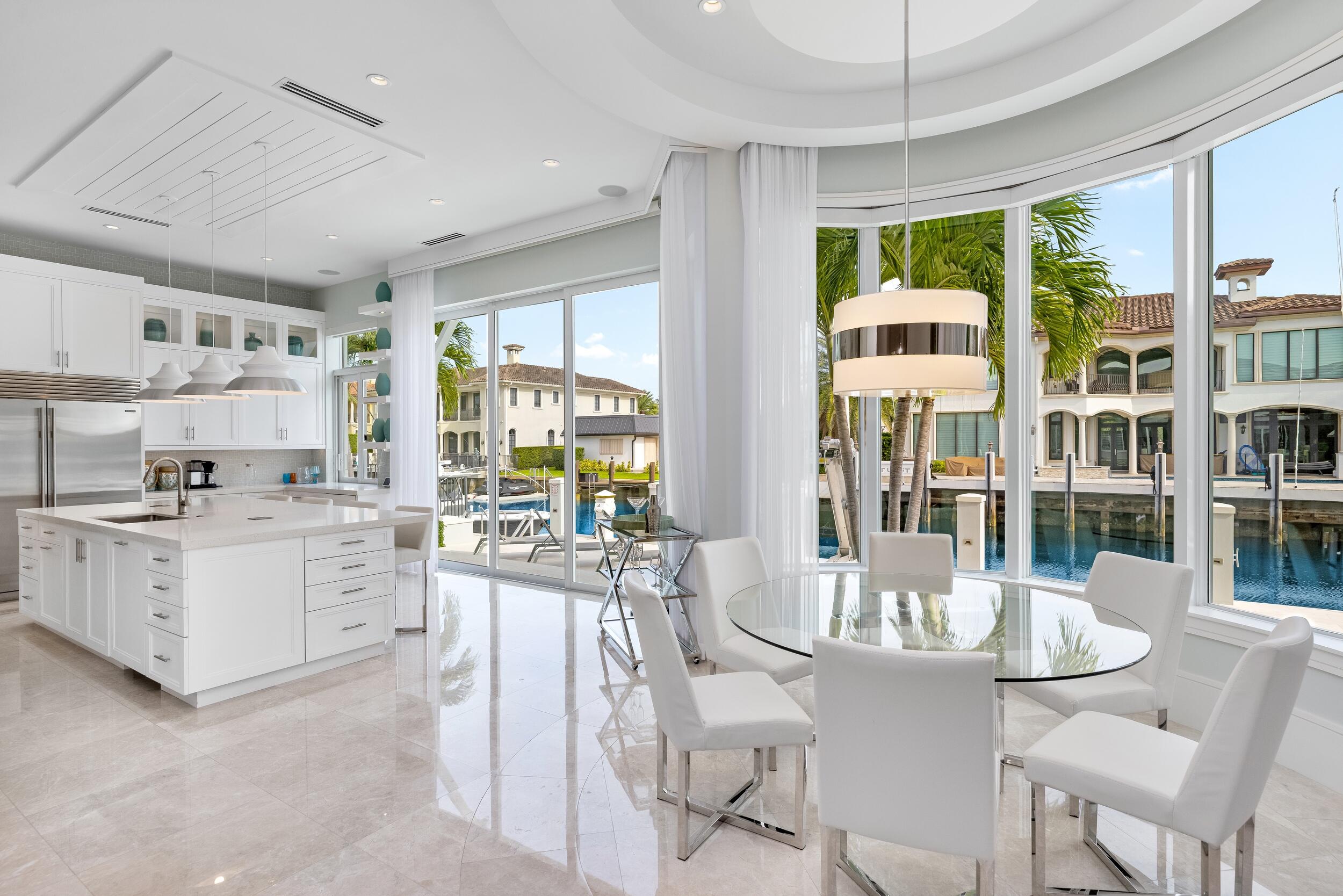 863 Enfield Street Boca Raton, FL 33487 - Photo 29 of 69 a kitchen with sink cabinets and dining table