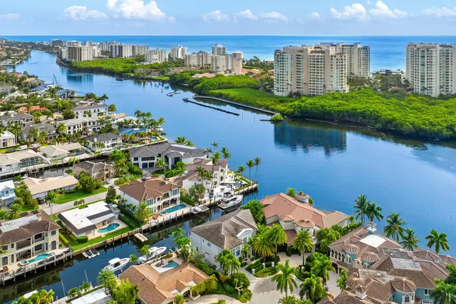 an aerial view of a city with a lake view
