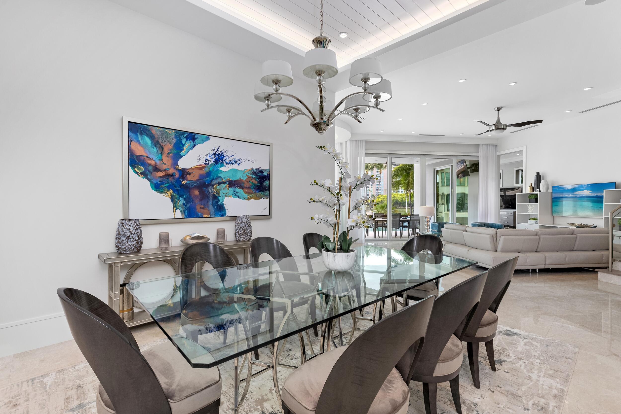 863 Enfield Street Boca Raton, FL 33487 - Photo 32 of 69 a dining room with furniture and a chandelier