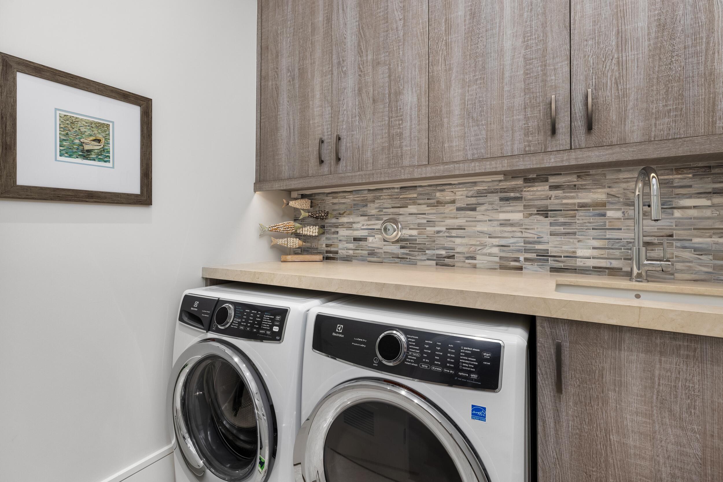 863 Enfield Street Boca Raton, FL 33487 - Photo 50 of 69 a view of washer and dryer in a kitchen