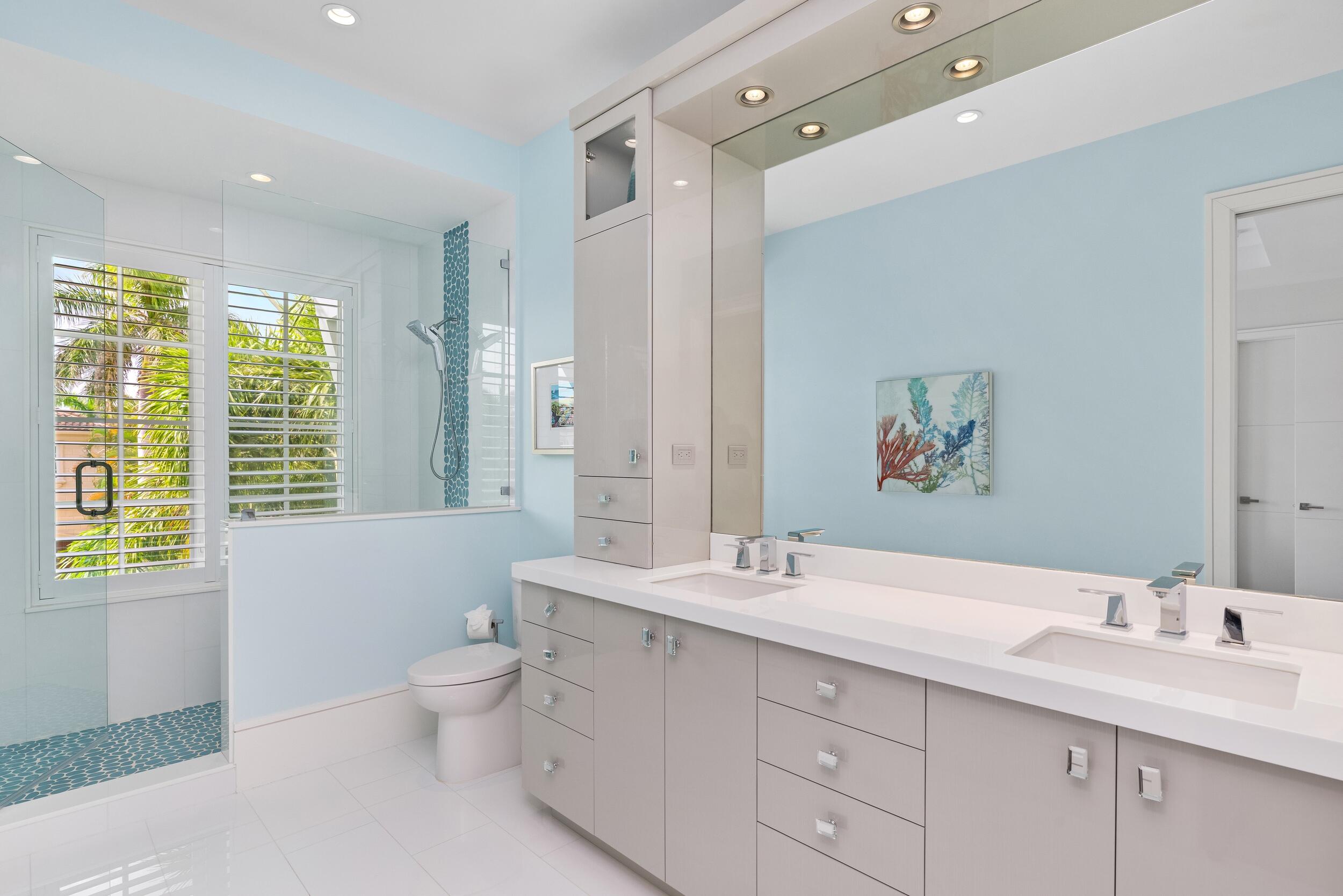 863 Enfield Street Boca Raton, FL 33487 - Photo 54 of 69 a bathroom with a double vanity sink toilet and a tub