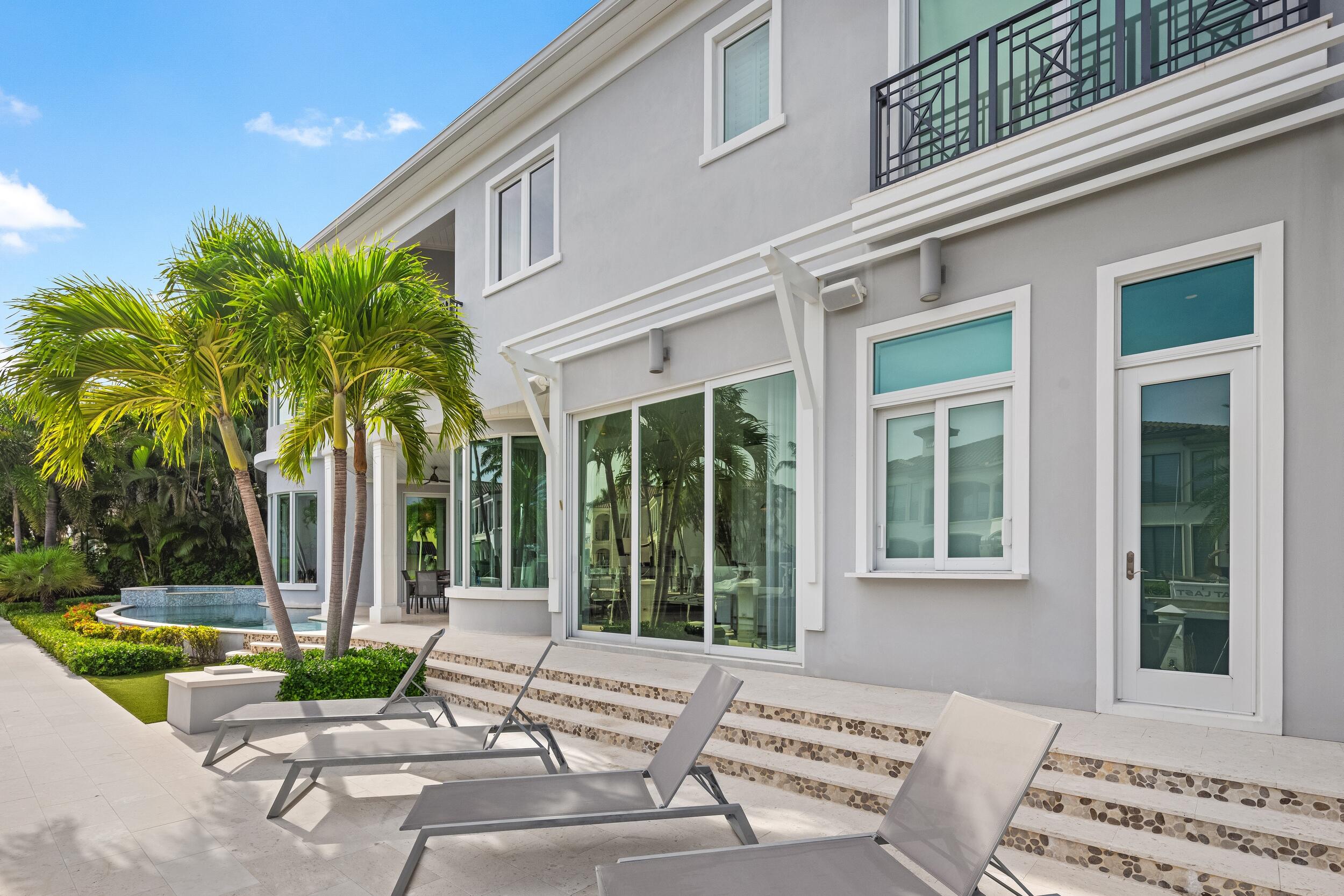863 Enfield Street Boca Raton, FL 33487 - Photo 64 of 69 a view of a house with backyard and swimming pool