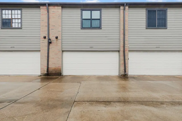 a picture of a bathroom with a shower and a mirror