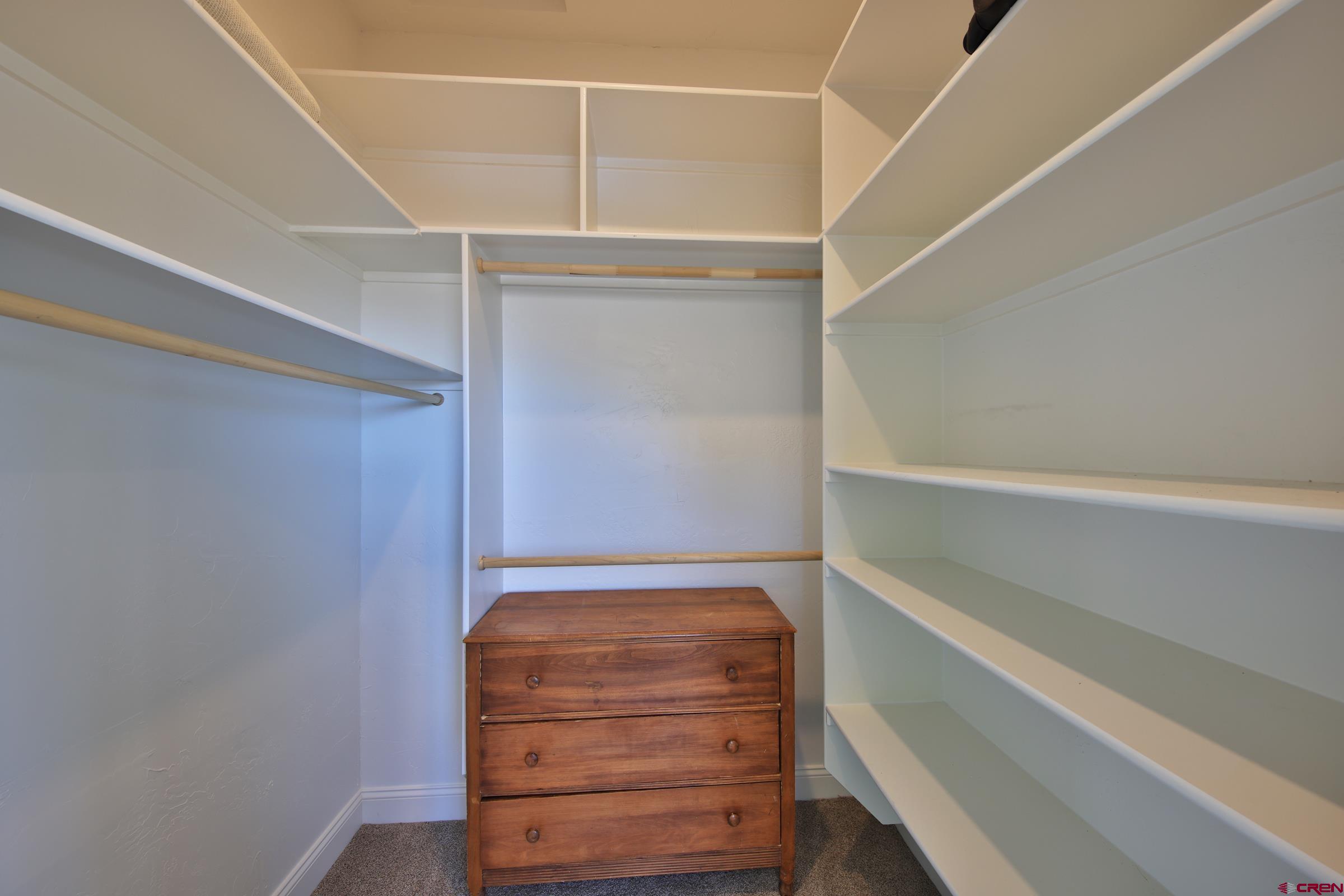 15086 45 45 1/2 Road De Beque, CO 81630 - Photo 11 of 40 a view of walk in closet with empty racks