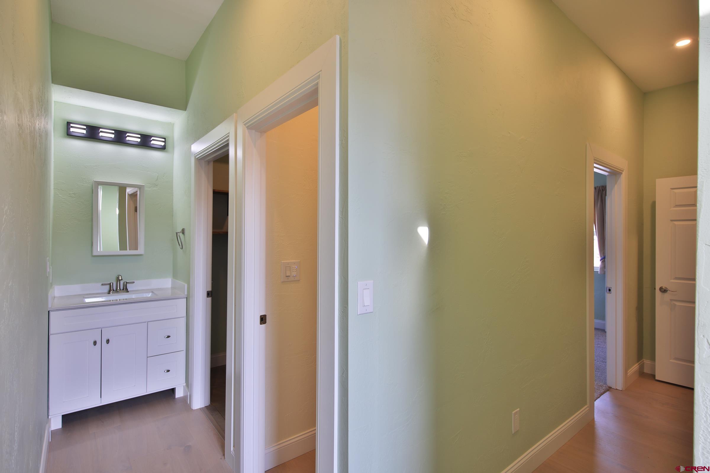 15086 45 45 1/2 Road De Beque, CO 81630 - Photo 12 of 40 a bathroom with a sink a mirror and a shower