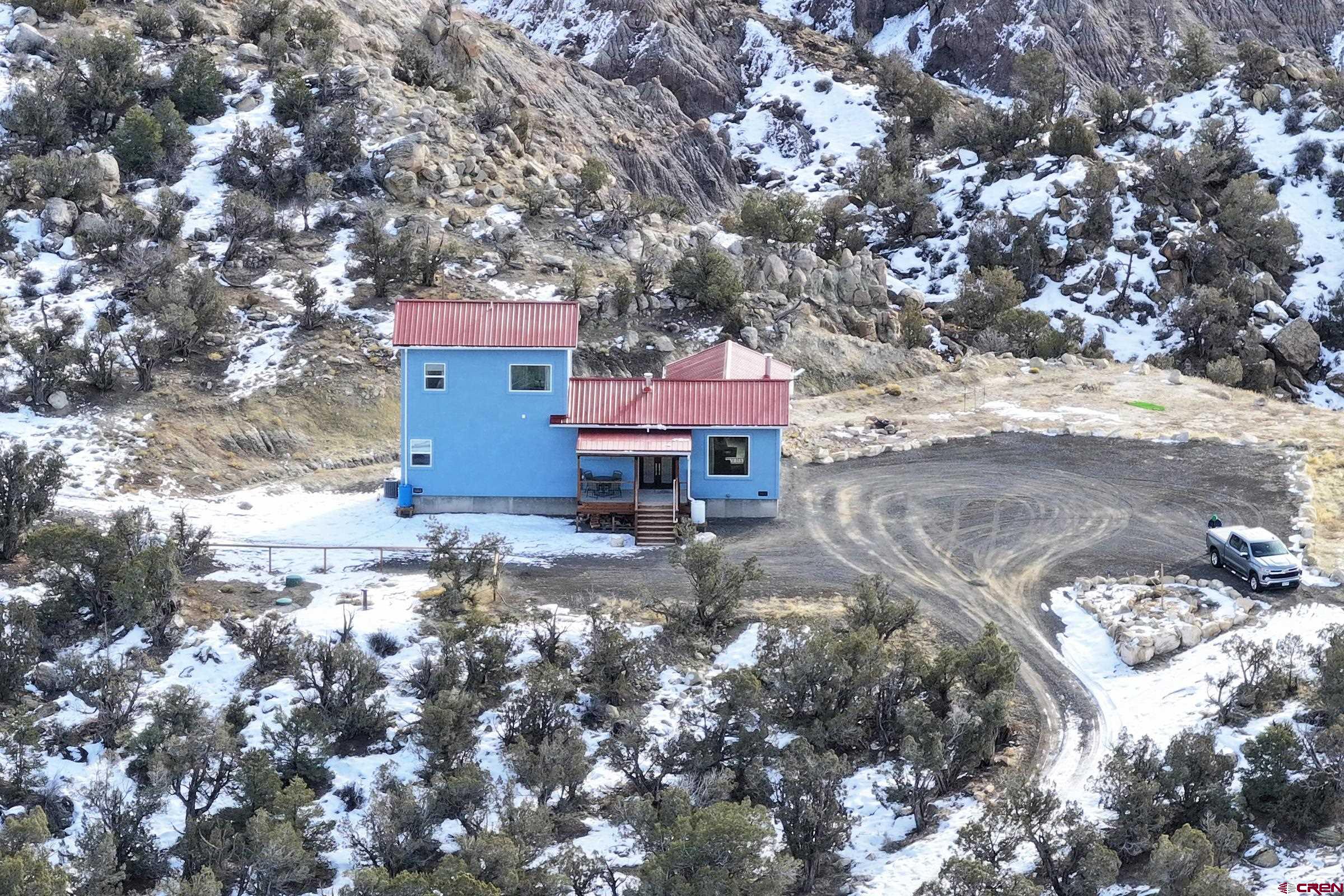 15086 45 45 1/2 Road De Beque, CO 81630 - Photo 30 of 40 a view of a house with a yard