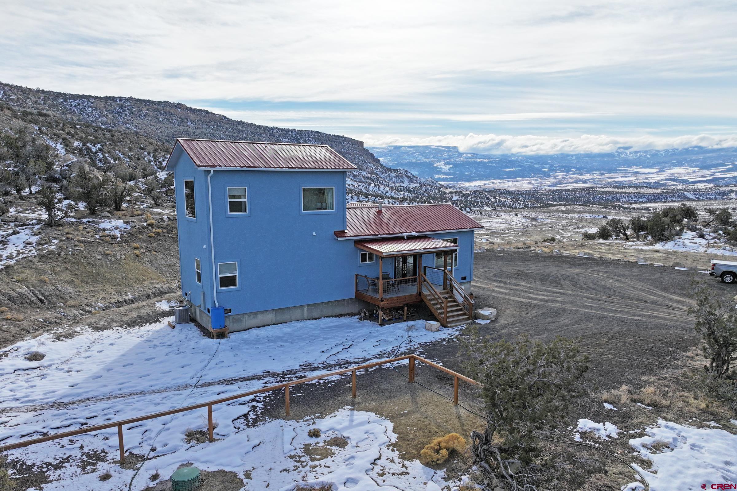 15086 45 45 1/2 Road De Beque, CO 81630 - Photo 31 of 40 a view of a terrace with a bench