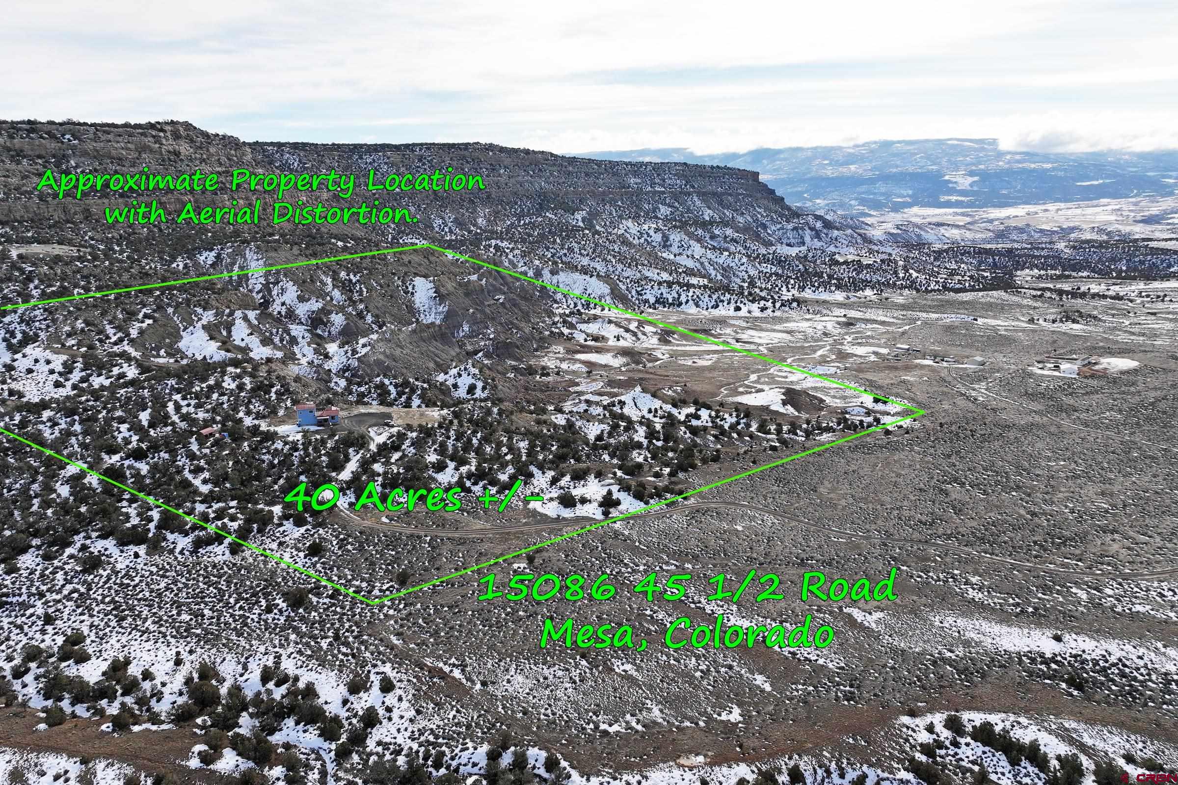 15086 45 45 1/2 Road De Beque, CO 81630 - Photo 4 of 40 a view of a large mountain with mountains in the background
