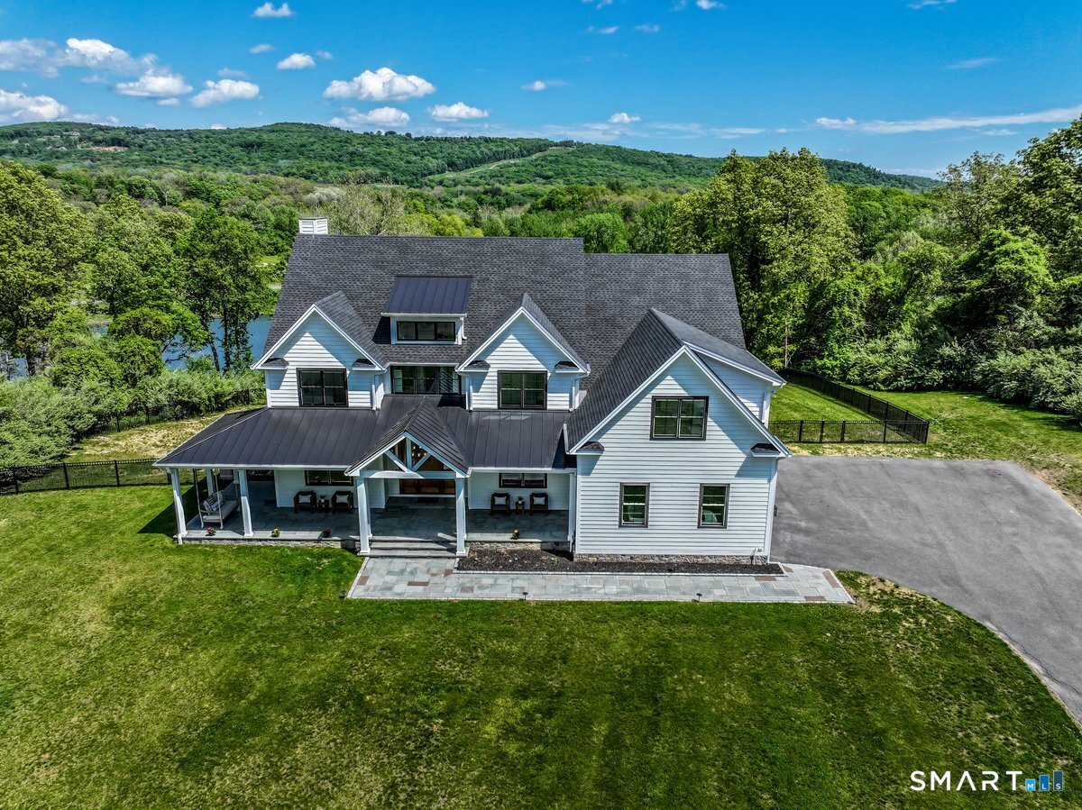 2 Pond View Lane Sherman, CT 06784 - Photo 3 of 40 a aerial view of a house with a yard table and chairs