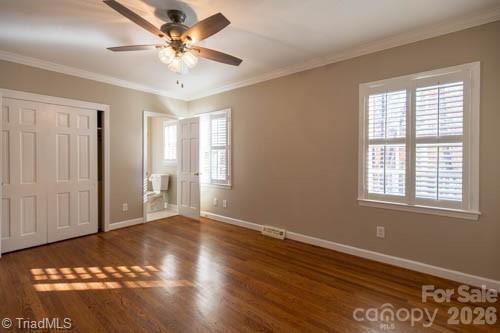 1405 Lyndhurst Drive High Point, NC 27262 - Photo 17 of 40 a view of an empty room with window and wooden floor
