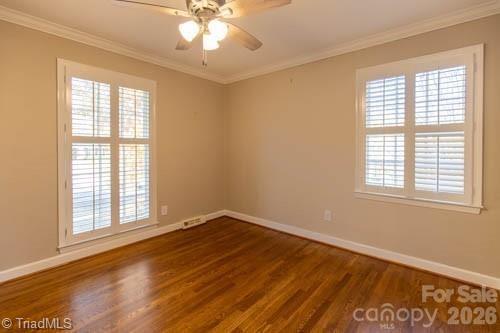 1405 Lyndhurst Drive High Point, NC 27262 - Photo 23 of 40 a view of an empty room with wooden floor and a window