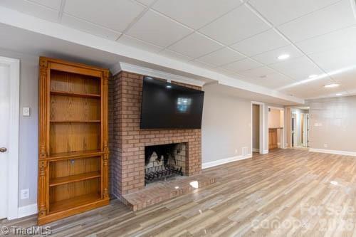 1405 Lyndhurst Drive High Point, NC 27262 - Photo 28 of 40 a view of an empty room with a fireplace and a window