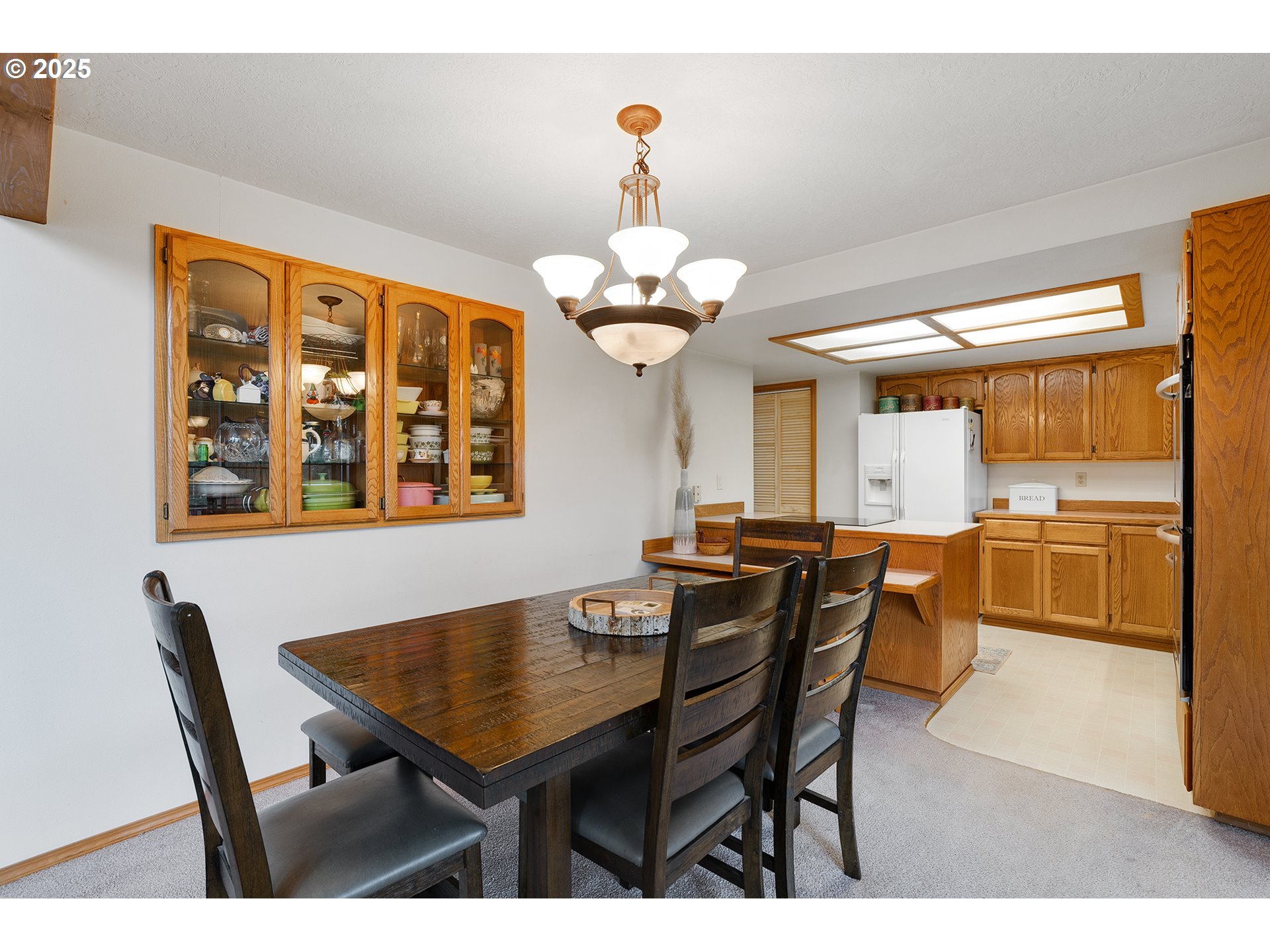 14018 South Spangler Road Oregon City, OR 97045 - Photo 12 of 34 a dining room with a table chairs and a dining table