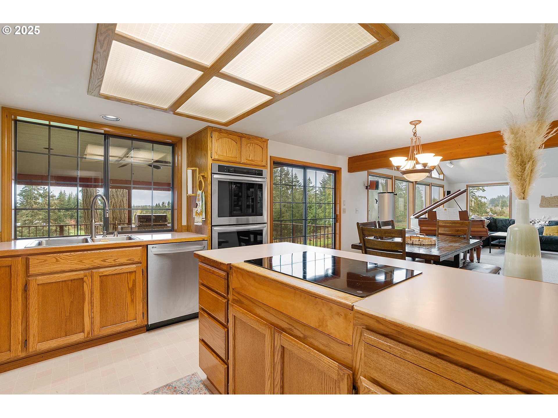 14018 South Spangler Road Oregon City, OR 97045 - Photo 14 of 34 a kitchen with stainless steel appliances granite countertop sink stove and cabinets