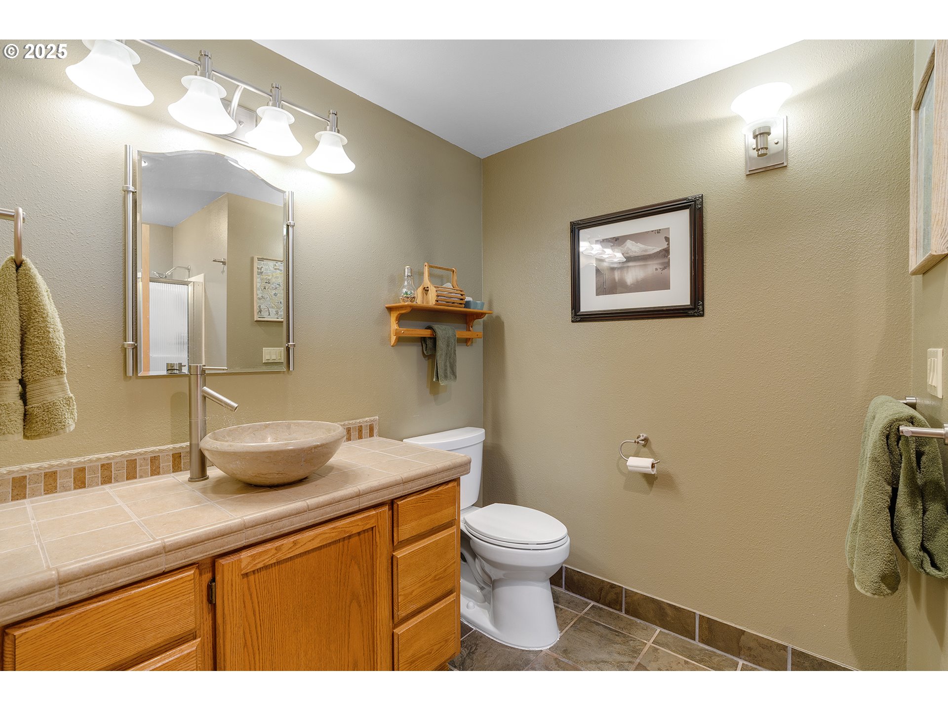 14018 South Spangler Road Oregon City, OR 97045 - Photo 17 of 34 a bathroom with a granite countertop sink mirror vanity and toilet