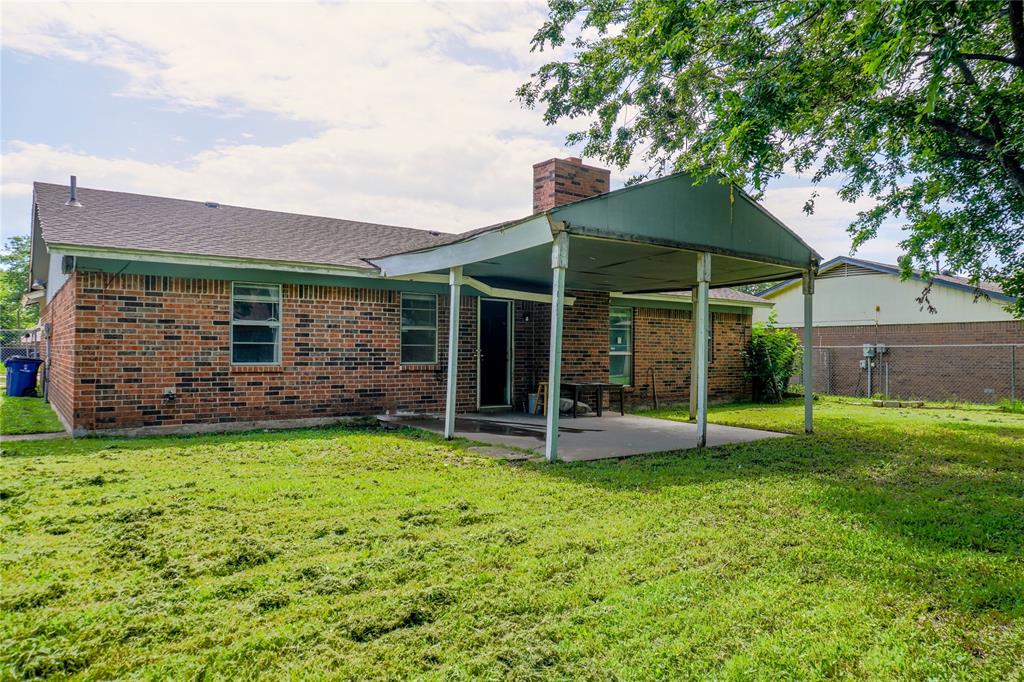 300 Coury Road Everman, TX 76140 - Photo 22 of 29 a view of a house with a backyard