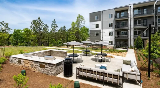 a view of swimming pool with seating area