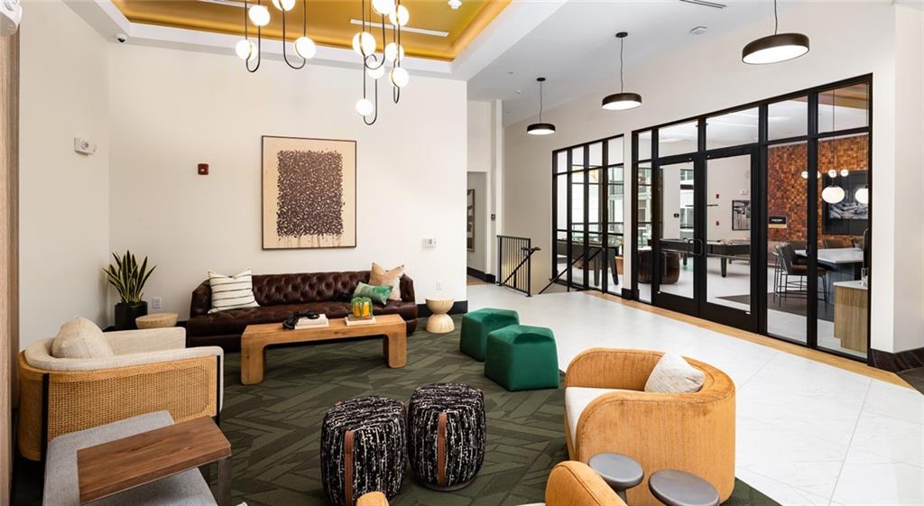 6000 Ava Avenue, Unit 4207 Gainesville, GA 30504 - Photo 25 of 34 a living room with furniture and a large window