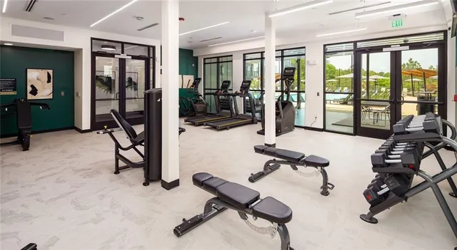 a view of game room with window and gym equipment