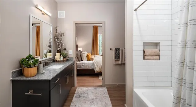 a en suite bathroom with a sink and a bathtub
