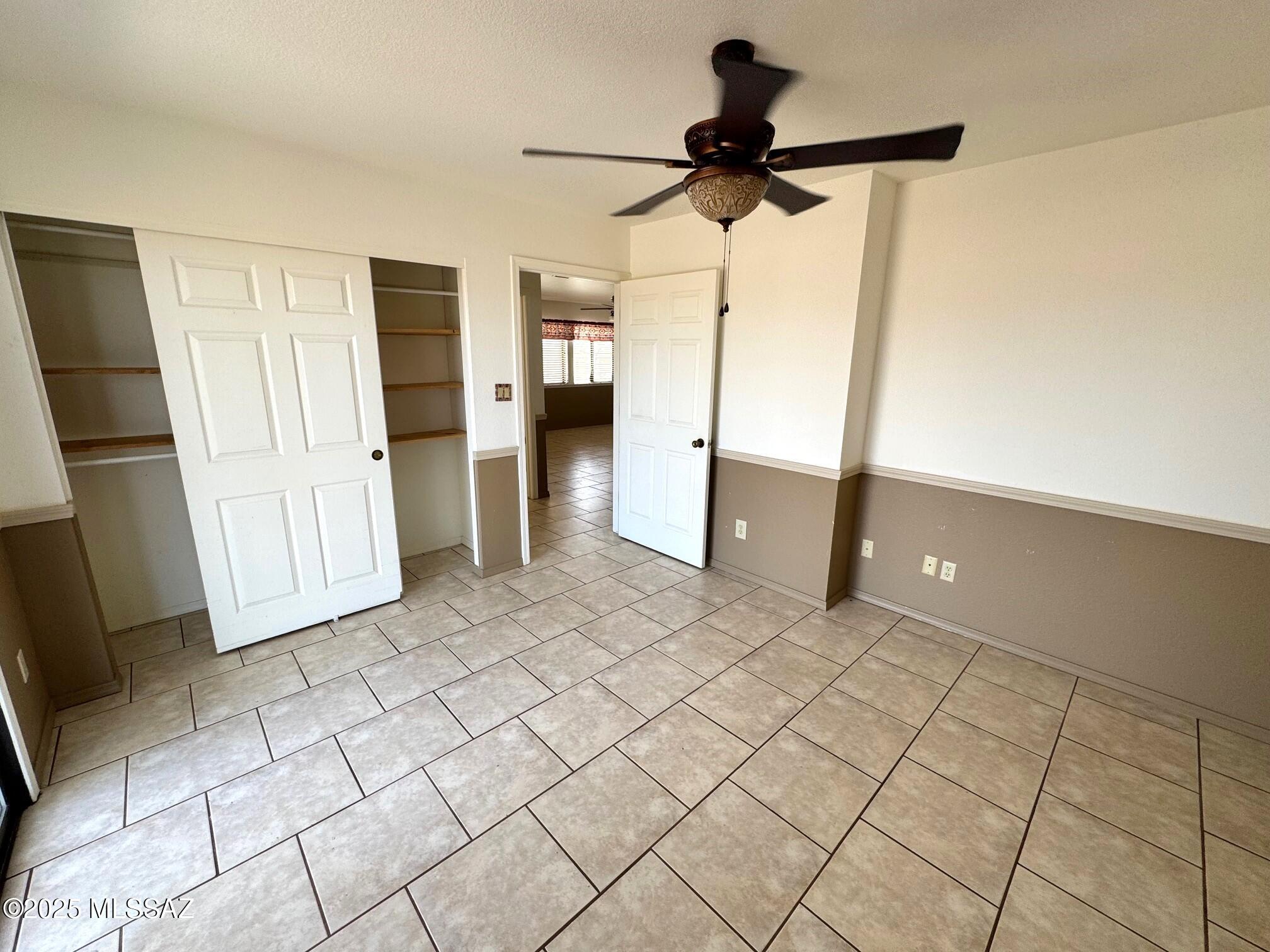 13384 South Cottonwood Road Pearce, AZ 85625 - Photo 22 of 46 a view of empty room with wooden floor