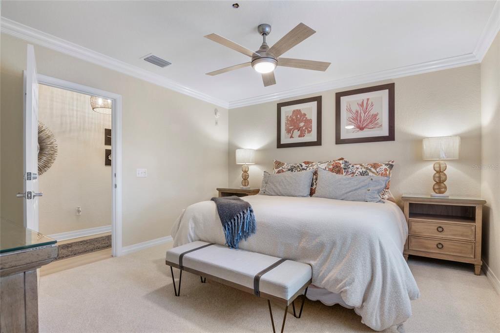 7600 Sandy Ridge Drive, Unit 204 Reunion, FL 34747 - Photo 14 of 39 a bedroom with a bed and a couch