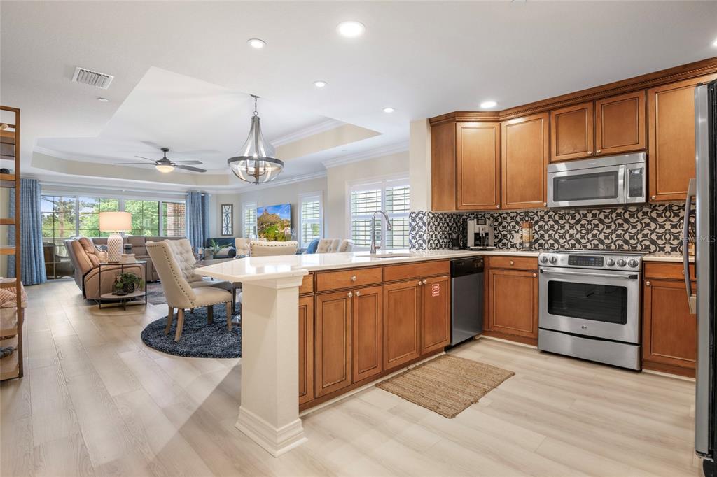 7600 Sandy Ridge Drive, Unit 204 Reunion, FL 34747 - Photo 15 of 39 a kitchen with a sink cabinets and window