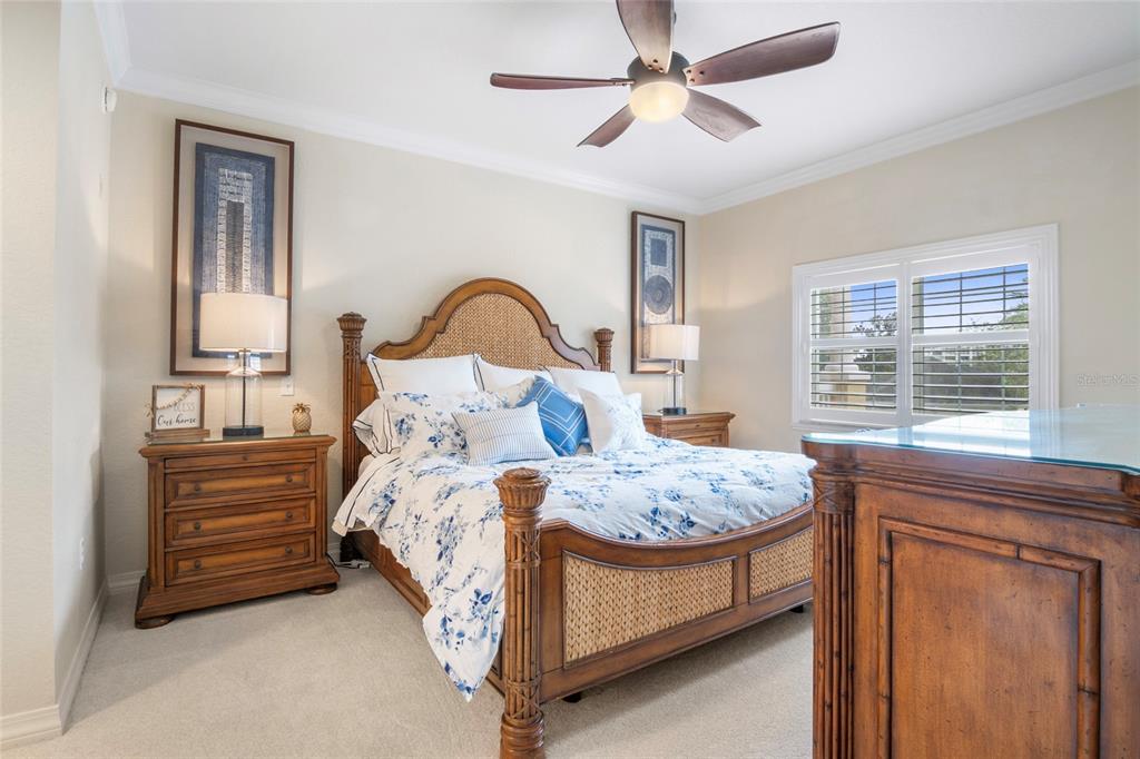 7600 Sandy Ridge Drive, Unit 204 Reunion, FL 34747 - Photo 17 of 39 a bed sitting in a bedroom next to a window