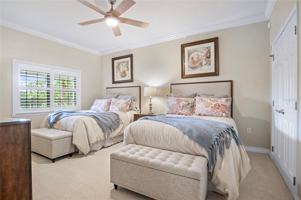7600 Sandy Ridge Drive, Unit 204 Reunion, FL 34747 - Photo 22 of 39 a bedroom with two beds and a couch