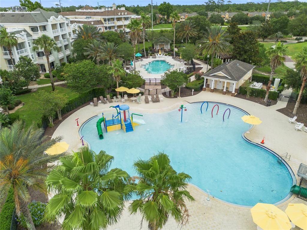 7600 Sandy Ridge Drive, Unit 204 Reunion, FL 34747 - Photo 29 of 39 a view of a swimming pool with a yard