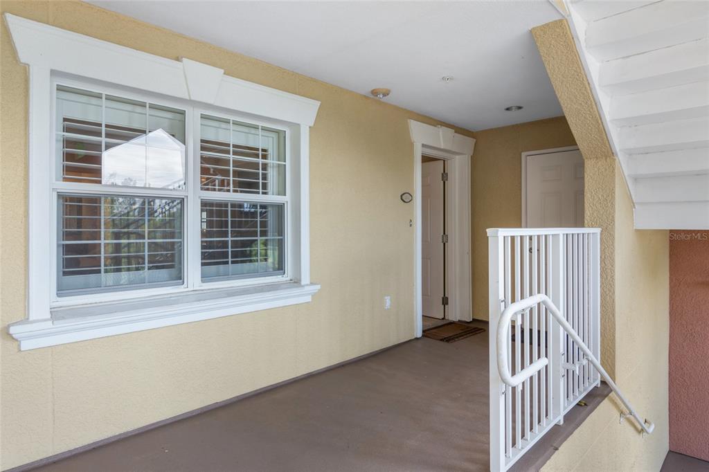 7600 Sandy Ridge Drive, Unit 204 Reunion, FL 34747 - Photo 4 of 39 a view of a hallway with a window