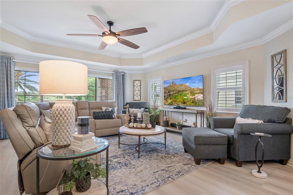 7600 Sandy Ridge Drive, Unit 204 Reunion, FL 34747 - Photo 7 of 39 a living room with furniture and a large window