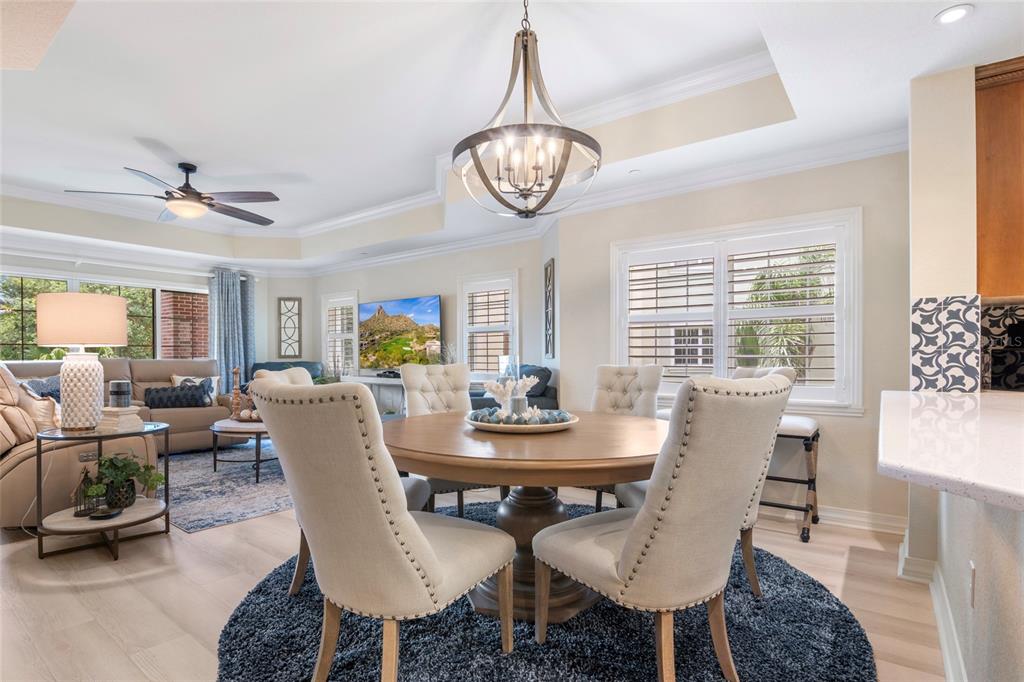 7600 Sandy Ridge Drive, Unit 204 Reunion, FL 34747 - Photo 8 of 39 a view of a dining room with furniture window and wooden floor