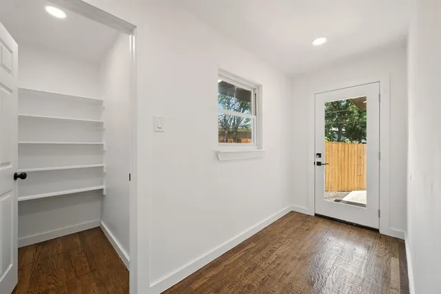 a view of a bathroom with wooden floor