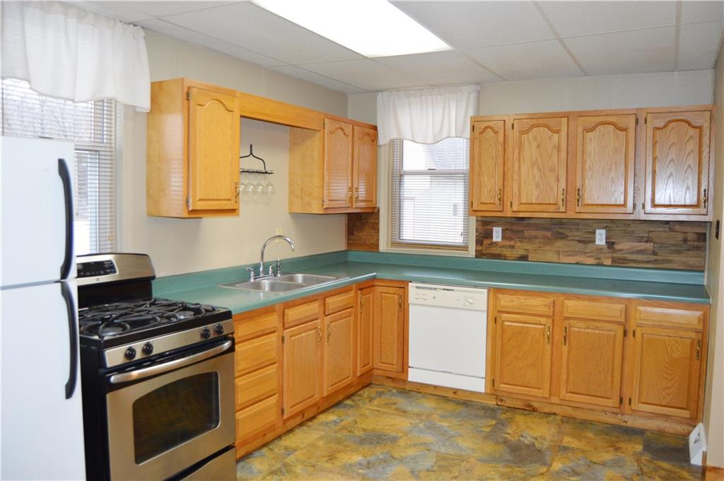 113 Riverside Drive Freeport, PA 16229 - Photo 3 of 25 Updated Large Kitchen OPENS to Dining Room with a view of the Fenced Yard. Appliances included.